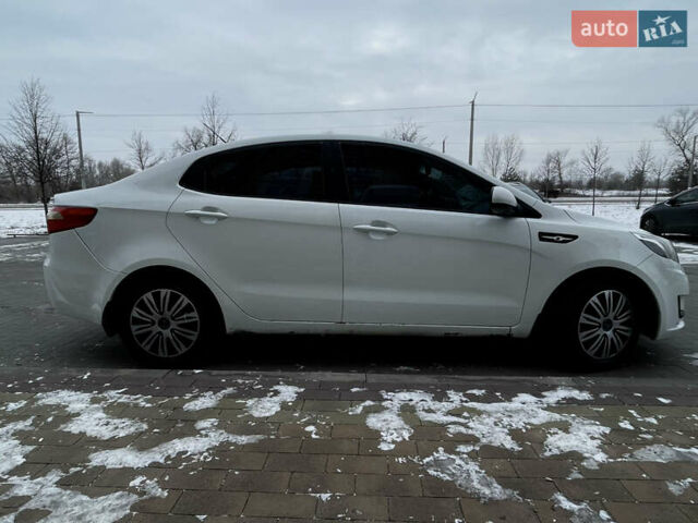 Білий Кіа Ріо, об'ємом двигуна 1.4 л та пробігом 210 тис. км за 6050 $, фото 7 на Automoto.ua