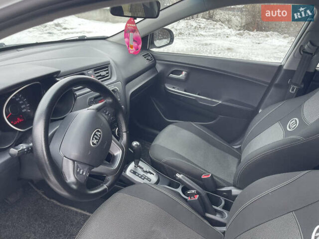 Білий Кіа Ріо, об'ємом двигуна 1.4 л та пробігом 216 тис. км за 7850 $, фото 24 на Automoto.ua