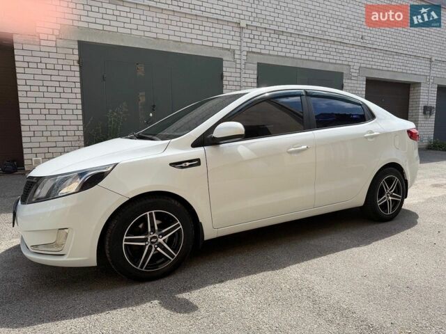 Белый Киа Рио, объемом двигателя 1.4 л и пробегом 143 тыс. км за 9199 $, фото 1 на Automoto.ua