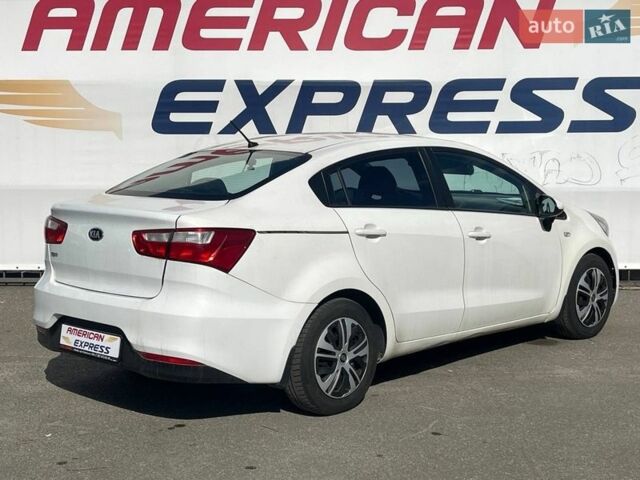 Білий Кіа Ріо, об'ємом двигуна 1.4 л та пробігом 88 тис. км за 8490 $, фото 5 на Automoto.ua