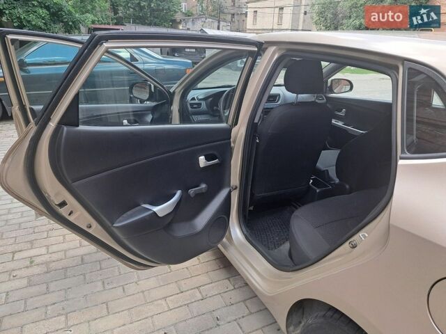 Бежевий Кіа Ріо, об'ємом двигуна 1.4 л та пробігом 145 тис. км за 6500 $, фото 10 на Automoto.ua