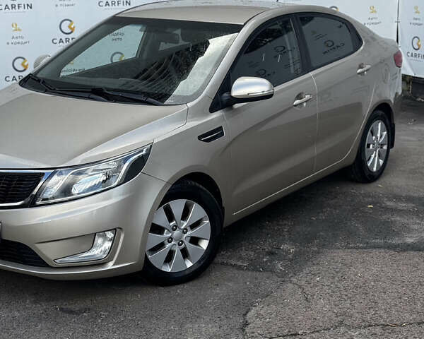 Бежевый Киа Рио, объемом двигателя 1.59 л и пробегом 122 тыс. км за 8600 $, фото 1 на Automoto.ua