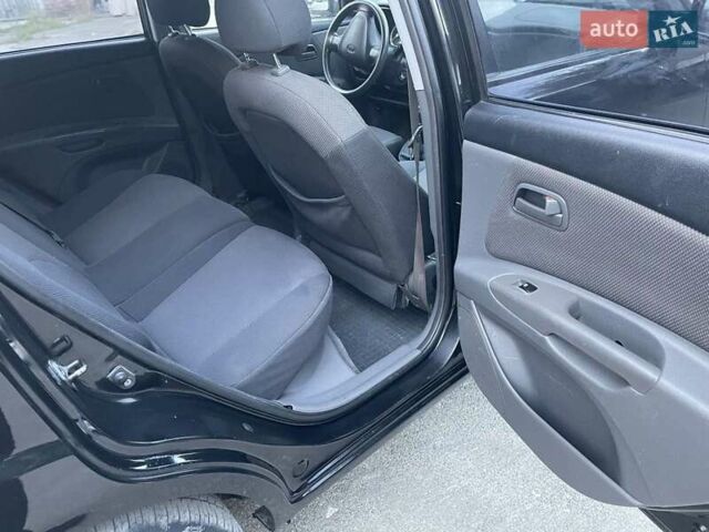 Черный Киа Рио, объемом двигателя 1.4 л и пробегом 265 тыс. км за 3900 $, фото 17 на Automoto.ua