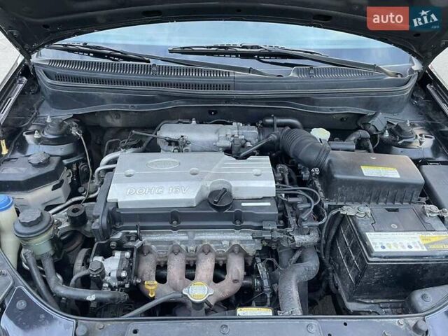 Черный Киа Рио, объемом двигателя 1.4 л и пробегом 265 тыс. км за 3900 $, фото 21 на Automoto.ua