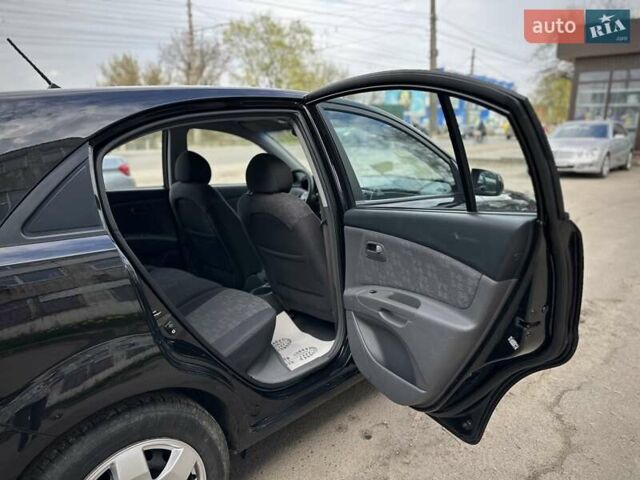Черный Киа Рио, объемом двигателя 1.4 л и пробегом 233 тыс. км за 5900 $, фото 80 на Automoto.ua