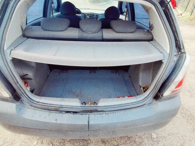 Черный Киа Рио, объемом двигателя 1.4 л и пробегом 132 тыс. км за 4000 $, фото 4 на Automoto.ua