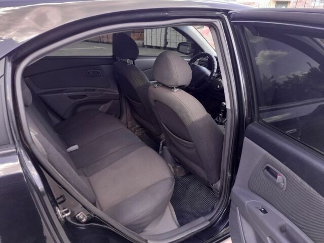 Черный Киа Рио, объемом двигателя 1.4 л и пробегом 185 тыс. км за 4300 $, фото 8 на Automoto.ua