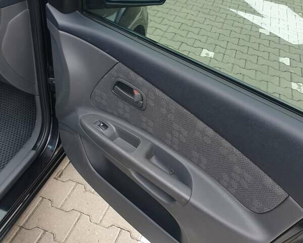 Чорний Кіа Ріо, об'ємом двигуна 1.4 л та пробігом 173 тис. км за 5250 $, фото 32 на Automoto.ua