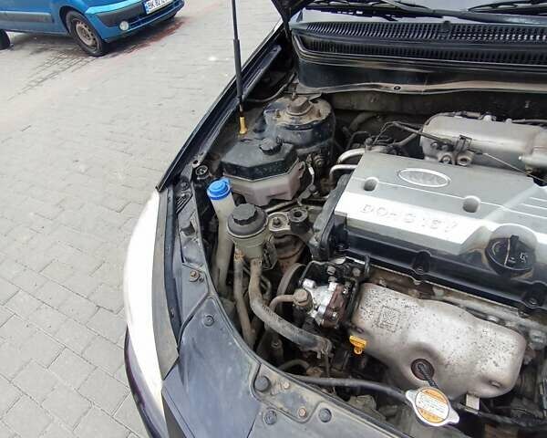 Черный Киа Рио, объемом двигателя 1.4 л и пробегом 203 тыс. км за 4499 $, фото 64 на Automoto.ua