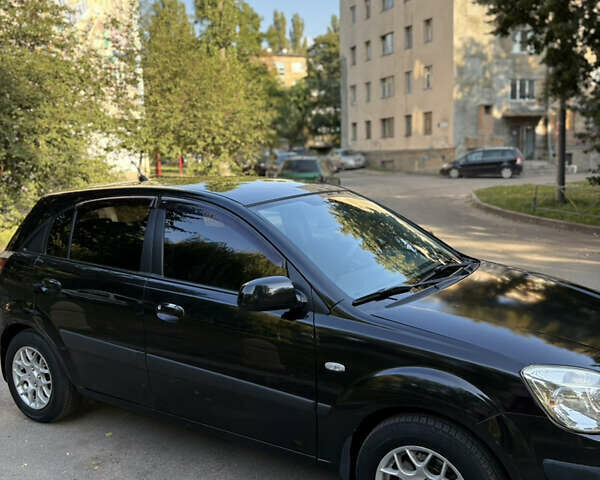Чорний Кіа Ріо, об'ємом двигуна 1.4 л та пробігом 215 тис. км за 6200 $, фото 6 на Automoto.ua