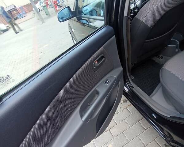 Черный Киа Рио, объемом двигателя 1.4 л и пробегом 203 тыс. км за 4499 $, фото 48 на Automoto.ua