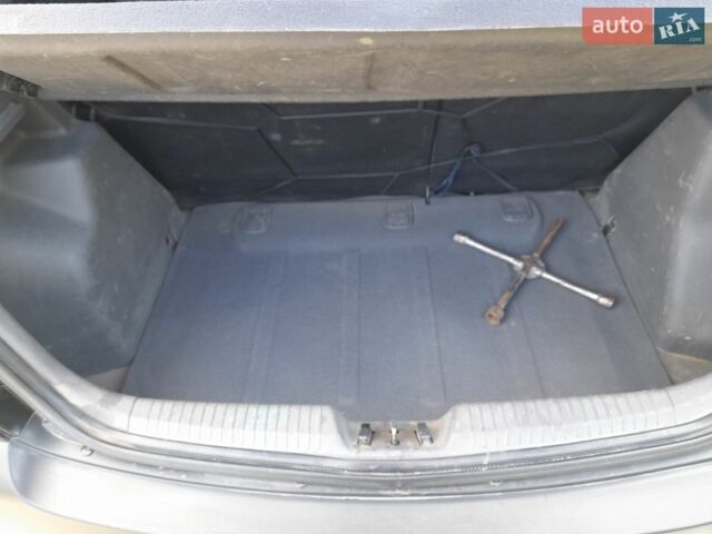 Черный Киа Рио, объемом двигателя 1.4 л и пробегом 220 тыс. км за 4500 $, фото 6 на Automoto.ua