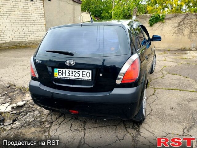 Черный Киа Рио, объемом двигателя 1.4 л и пробегом 110 тыс. км за 6399 $, фото 4 на Automoto.ua