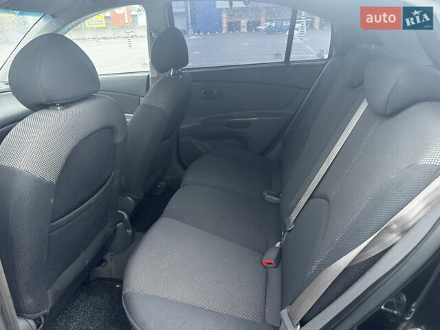 Черный Киа Рио, объемом двигателя 1.4 л и пробегом 208 тыс. км за 5400 $, фото 5 на Automoto.ua
