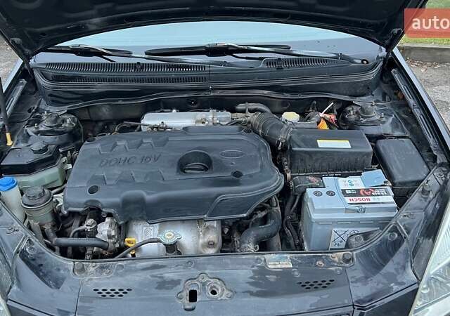 Черный Киа Рио, объемом двигателя 1.6 л и пробегом 230 тыс. км за 4900 $, фото 26 на Automoto.ua