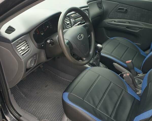 Чорний Кіа Ріо, об'ємом двигуна 1.4 л та пробігом 173 тис. км за 5250 $, фото 4 на Automoto.ua