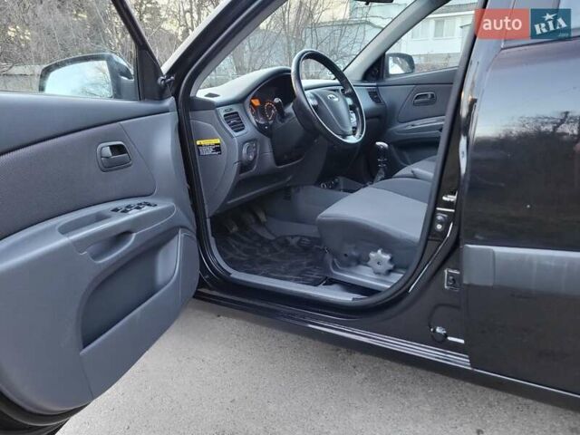 Чорний Кіа Ріо, об'ємом двигуна 1.4 л та пробігом 184 тис. км за 4800 $, фото 16 на Automoto.ua
