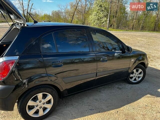 Черный Киа Рио, объемом двигателя 1.4 л и пробегом 103 тыс. км за 3400 $, фото 9 на Automoto.ua