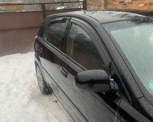 Черный Киа Рио, объемом двигателя 1.4 л и пробегом 86 тыс. км за 5300 $, фото 3 на Automoto.ua