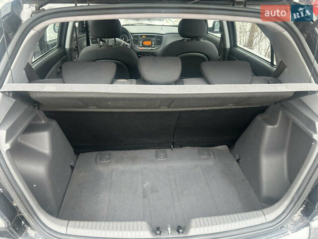 Чорний Кіа Ріо, об'ємом двигуна 1.4 л та пробігом 166 тис. км за 5450 $, фото 11 на Automoto.ua