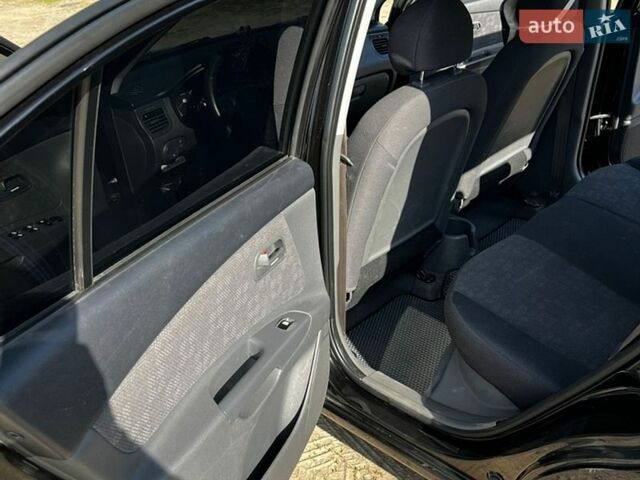 Черный Киа Рио, объемом двигателя 1.4 л и пробегом 103 тыс. км за 3400 $, фото 19 на Automoto.ua