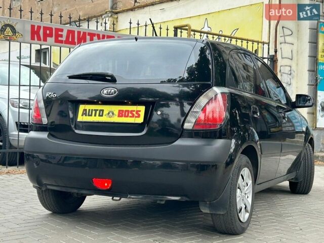 Чорний Кіа Ріо, об'ємом двигуна 1.4 л та пробігом 260 тис. км за 4800 $, фото 5 на Automoto.ua