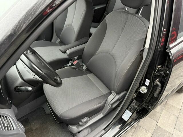 Черный Киа Рио, объемом двигателя 1.4 л и пробегом 166 тыс. км за 5999 $, фото 6 на Automoto.ua