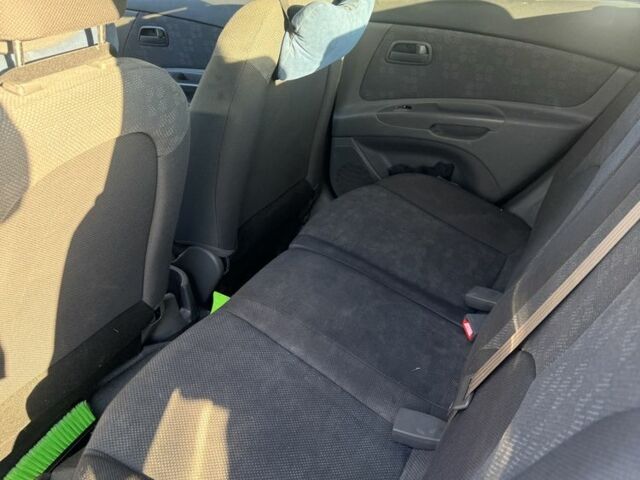 Чорний Кіа Ріо, об'ємом двигуна 1.4 л та пробігом 208 тис. км за 6200 $, фото 4 на Automoto.ua