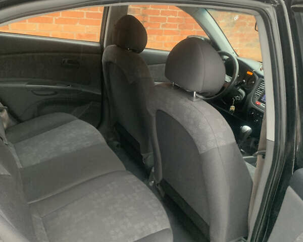 Черный Киа Рио, объемом двигателя 1.4 л и пробегом 86 тыс. км за 5300 $, фото 12 на Automoto.ua