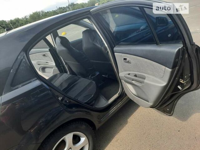Черный Киа Рио, объемом двигателя 1.4 л и пробегом 222 тыс. км за 4100 $, фото 7 на Automoto.ua