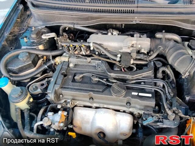 Черный Киа Рио, объемом двигателя 1.4 л и пробегом 349 тыс. км за 2599 $, фото 11 на Automoto.ua