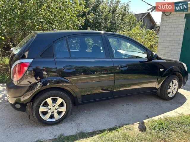 Черный Киа Рио, объемом двигателя 1.4 л и пробегом 214 тыс. км за 5100 $, фото 1 на Automoto.ua