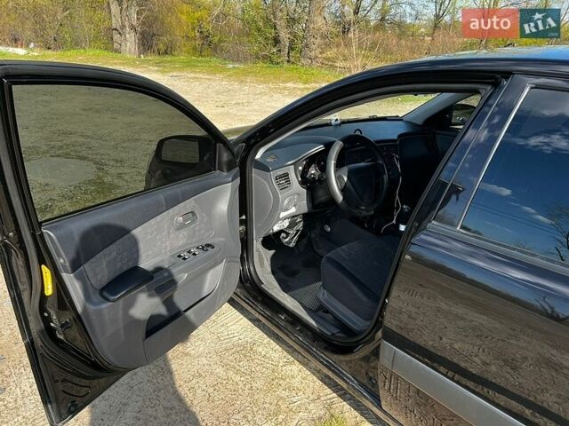 Черный Киа Рио, объемом двигателя 1.4 л и пробегом 103 тыс. км за 3400 $, фото 16 на Automoto.ua
