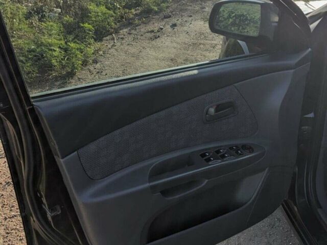 Чорний Кіа Ріо, об'ємом двигуна 1.4 л та пробігом 160 тис. км за 6200 $, фото 12 на Automoto.ua