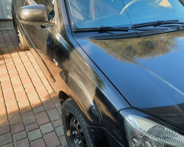 Черный Киа Рио, объемом двигателя 1.4 л и пробегом 390 тыс. км за 3500 $, фото 5 на Automoto.ua