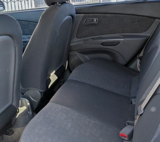 Чорний Кіа Ріо, об'ємом двигуна 1.4 л та пробігом 287 тис. км за 4400 $, фото 10 на Automoto.ua