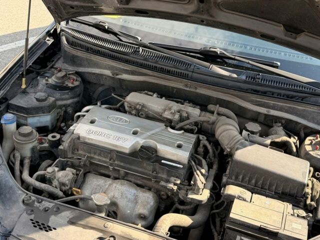 Чорний Кіа Ріо, об'ємом двигуна 1.4 л та пробігом 260 тис. км за 4600 $, фото 11 на Automoto.ua