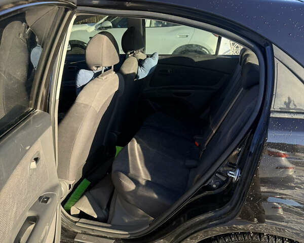 Чорний Кіа Ріо, об'ємом двигуна 1.4 л та пробігом 208 тис. км за 6200 $, фото 6 на Automoto.ua