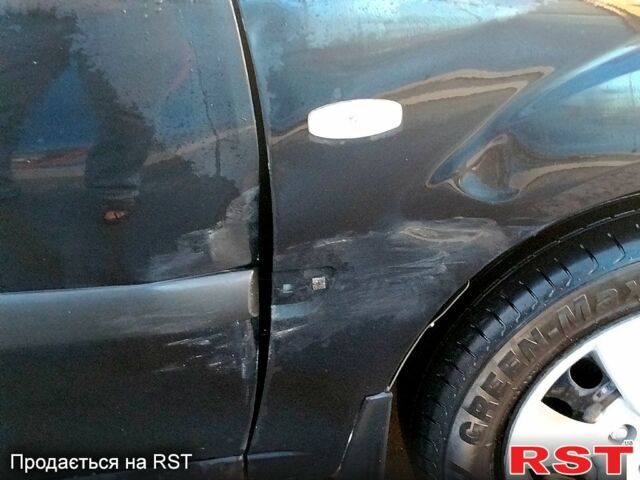 Черный Киа Рио, объемом двигателя 1.4 л и пробегом 349 тыс. км за 2599 $, фото 8 на Automoto.ua