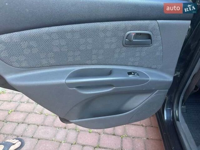 Черный Киа Рио, объемом двигателя 1.4 л и пробегом 102 тыс. км за 4499 $, фото 30 на Automoto.ua