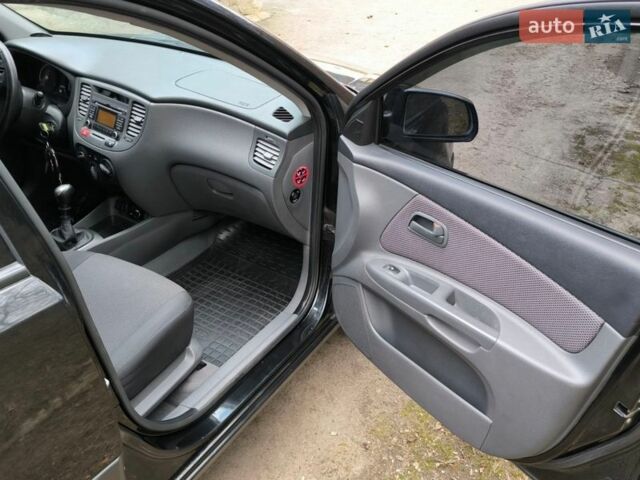 Чорний Кіа Ріо, об'ємом двигуна 1.4 л та пробігом 198 тис. км за 5200 $, фото 9 на Automoto.ua