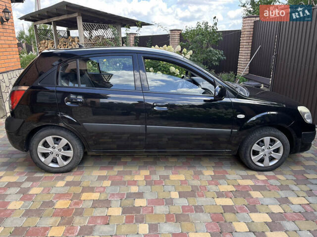 Черный Киа Рио, объемом двигателя 1.4 л и пробегом 174 тыс. км за 4200 $, фото 9 на Automoto.ua