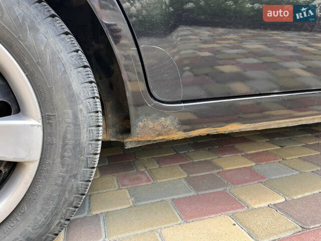 Черный Киа Рио, объемом двигателя 1.4 л и пробегом 174 тыс. км за 4200 $, фото 12 на Automoto.ua