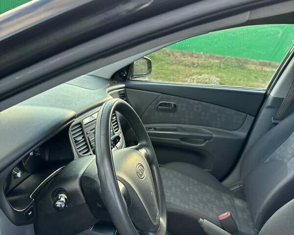 Черный Киа Рио, объемом двигателя 1.4 л и пробегом 220 тыс. км за 4399 $, фото 12 на Automoto.ua