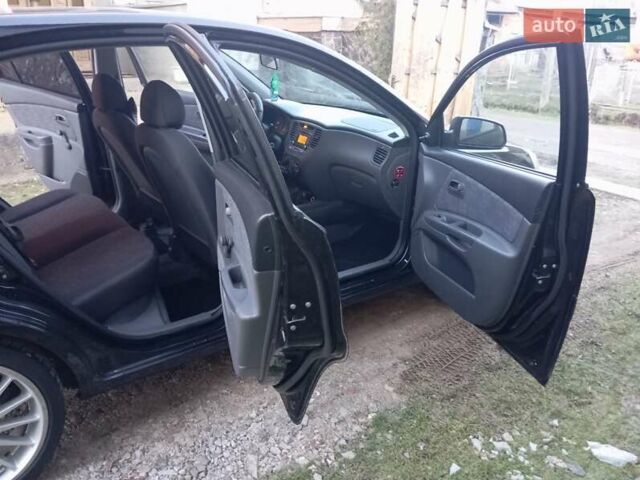 Черный Киа Рио, объемом двигателя 1.4 л и пробегом 201 тыс. км за 4699 $, фото 8 на Automoto.ua