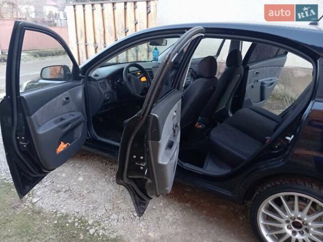 Черный Киа Рио, объемом двигателя 1.4 л и пробегом 201 тыс. км за 4699 $, фото 7 на Automoto.ua