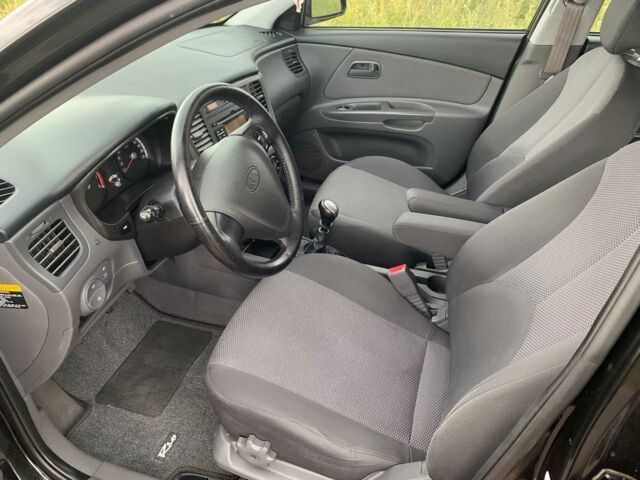Черный Киа Рио, объемом двигателя 1.4 л и пробегом 98 тыс. км за 6200 $, фото 3 на Automoto.ua