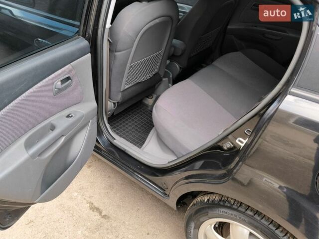 Чорний Кіа Ріо, об'ємом двигуна 1.4 л та пробігом 198 тис. км за 5200 $, фото 5 на Automoto.ua