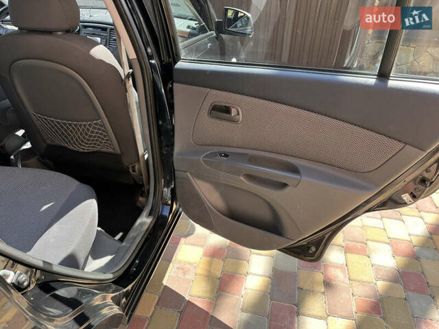 Черный Киа Рио, объемом двигателя 1.4 л и пробегом 174 тыс. км за 4200 $, фото 23 на Automoto.ua