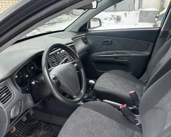 Черный Киа Рио, объемом двигателя 1.4 л и пробегом 220 тыс. км за 4500 $, фото 15 на Automoto.ua